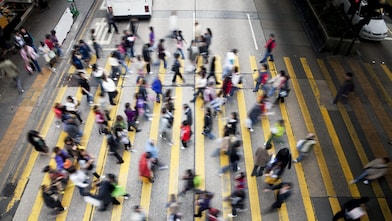 People crossing a busy street in Hong Kong