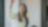 A woman placing post its on a glass wall