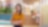 A woman standing in a warm and vibrant office ambiance