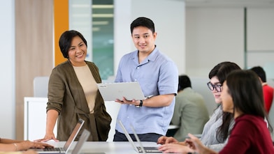 individuals are collaborating in a modern office