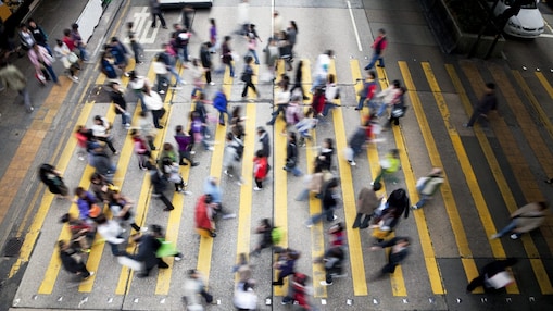 People crossing a busy street in Hong Kong