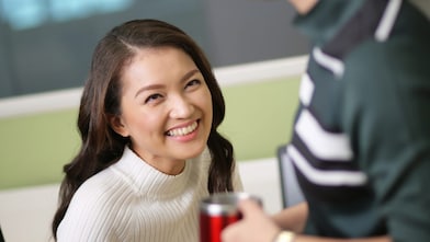 A young Shell female employee smiling.