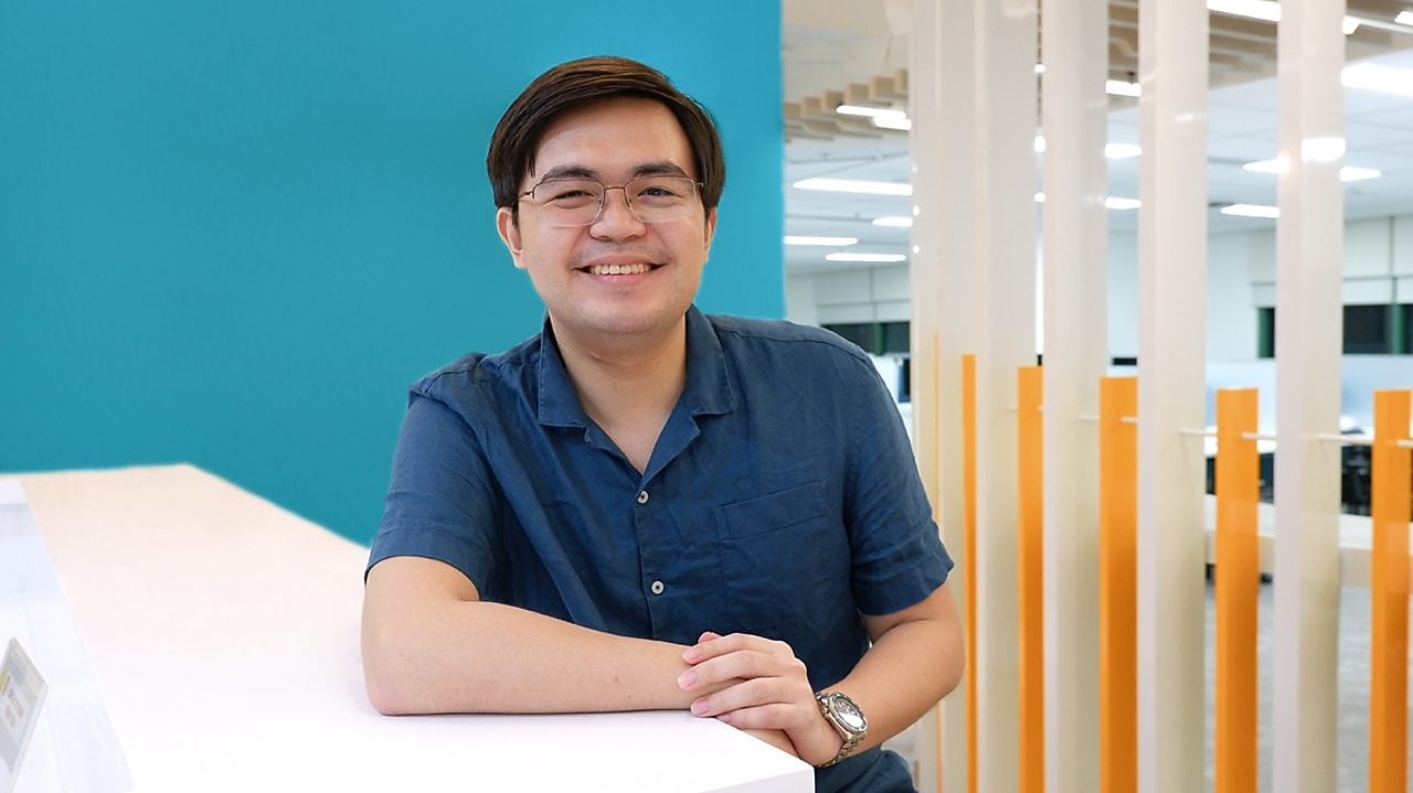 A man sitting at a desk in an office