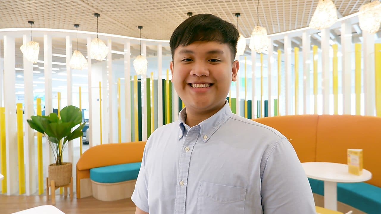 A man standing in a warm and vibrant office ambiance