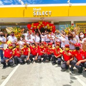 Shell Bridges Town Plaridel Mandaue station forecourt staff celebrate the opening of the new mobility station