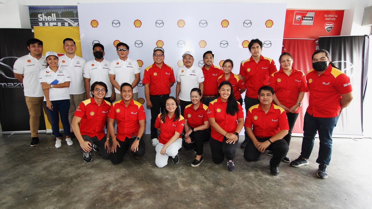 Group of people posing for picture