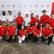 Group of people posing for picture