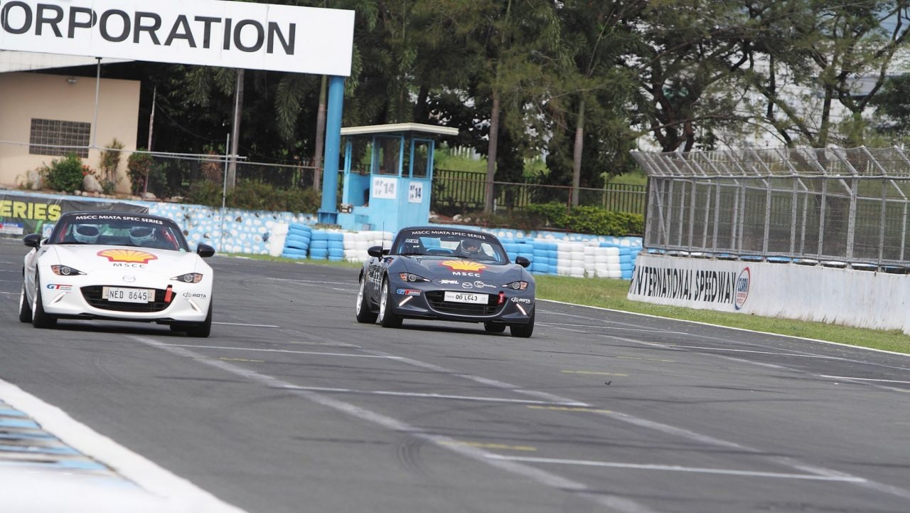 Two cars on a racetrack