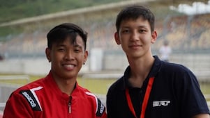 Philippine team's driver, Mark Angelo Jacinto, and Kazakhstan team's driver, Sakenov Erasyl, pose for the camera after their teams worked together for the PH team to successfully complete the Technical Inspection