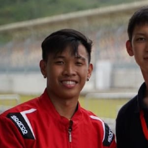 Philippine team's driver, Mark Angelo Jacinto, and Kazakhstan team's driver, Sakenov Erasyl, pose for the camera after their teams worked together for the PH team to successfully complete the Technical Inspection