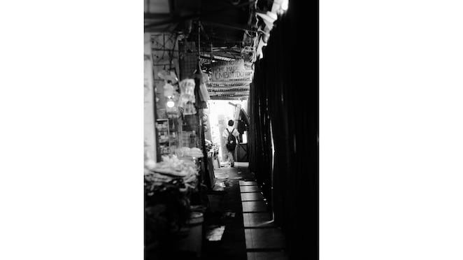 PHOTOGRAPHY: This image contrasts the Filipino society’s rich tradition with its journey toward progress, symbolized by the student walking toward light, representing youth as a force for positive change.