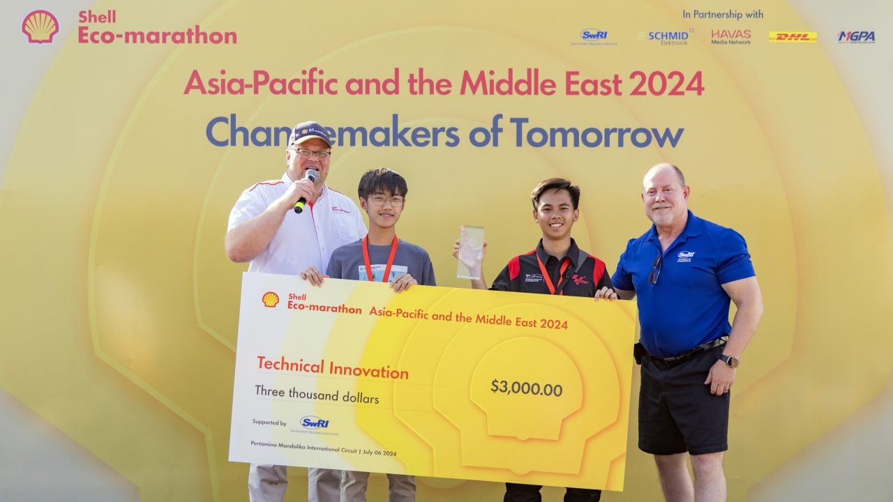 The Cardinals from Mapua University accept their $3,000 prize for the Technical Innovation Award at the Shell Eco-marathon Asia-Pacific and the Middle East 2024, celebrating their innovative approach to energy-efficient vehicle design.