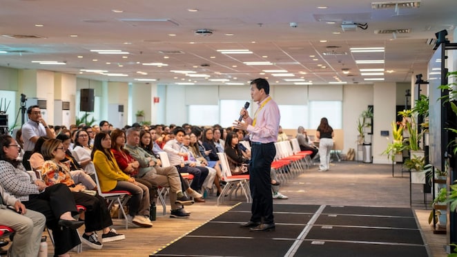 Theodore Leonin, Head of SBO Manila and Real Estate Philippines, addresses employees during the SBO Manila Town Hall.