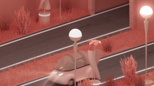 Car driving past a roadside wind turbine