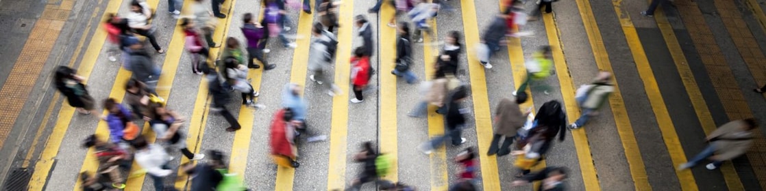 People crossing a busy street in Hong Kong