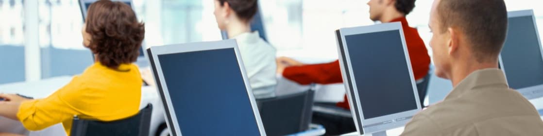 Employees using computers in an office