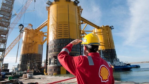 Engineer looking up at platform under construction