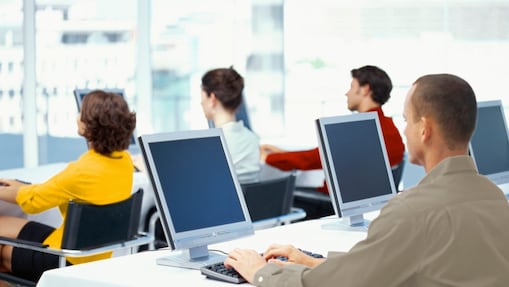 Employees using computers in an office