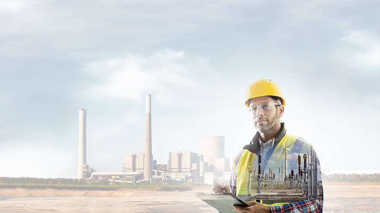 worker in a yellow hard hat transposed onto a background of a power plant