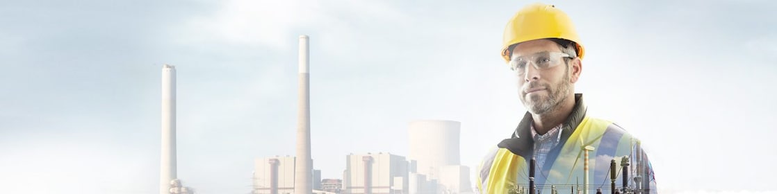 worker in a yellow hard hat transposed onto a background of a power plant