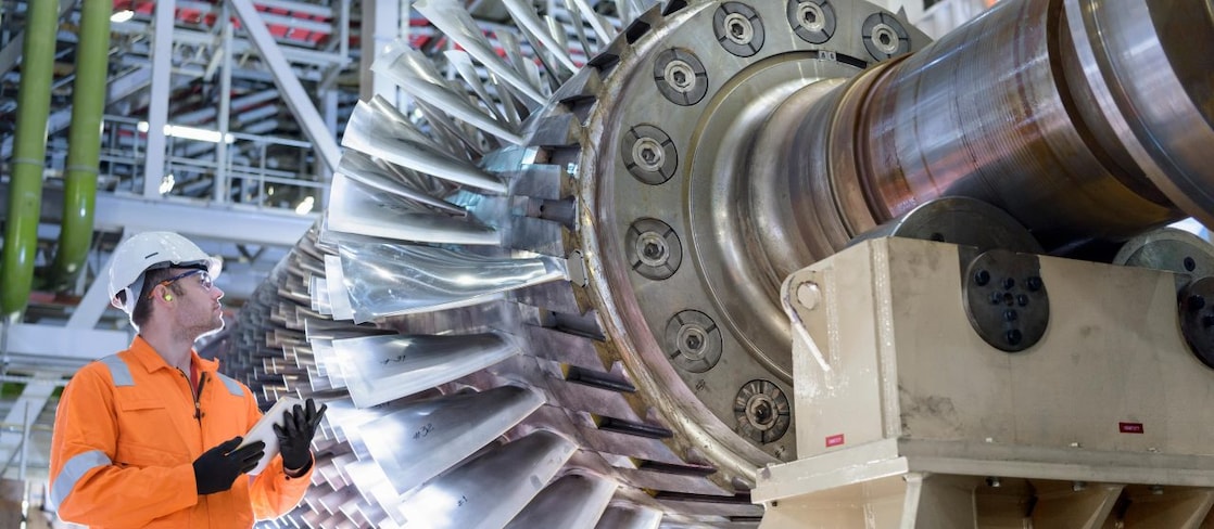 Gas turbine under repair in gas-fired power station.