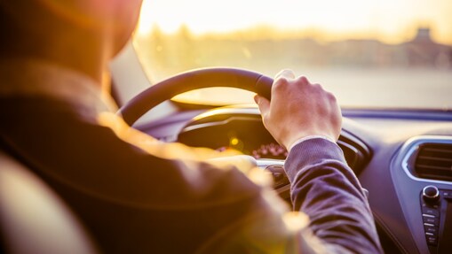 man driving a car