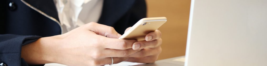 women Working with Laptop and Cell