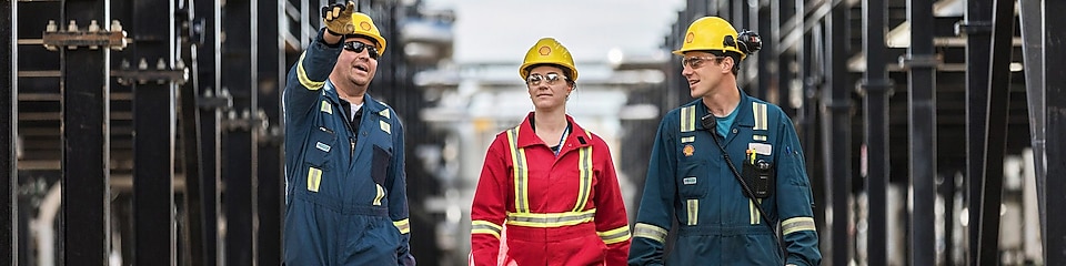 Shell engineers walking together at an operational site