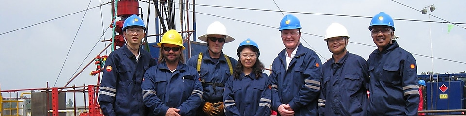 Lydia Qin on site in gas field with her colleagues