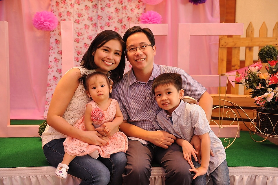 Donna Kuizon Cruz with her partner and two children