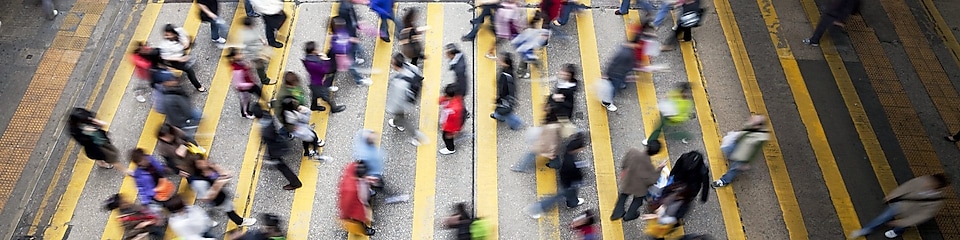 People crossing a busy street in Hong Kong