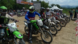 Motorcross motorcycles lining up at the start of a race