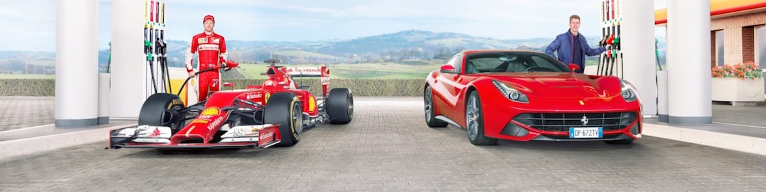 Sebastian Vettel and Kimi Raikkonen fill up Ferrari cars at a Shell station