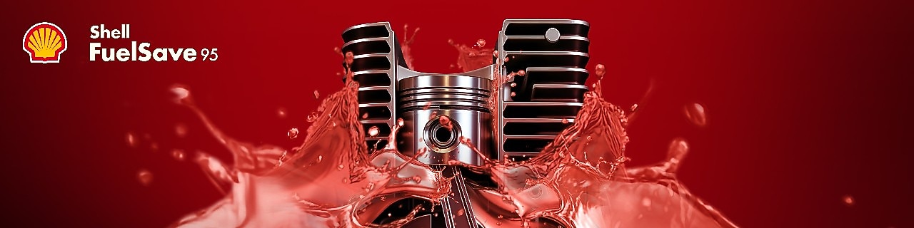 2-wheeler engine piston in the middle of the image, with gasoline fuel visually splashing around the engine piston