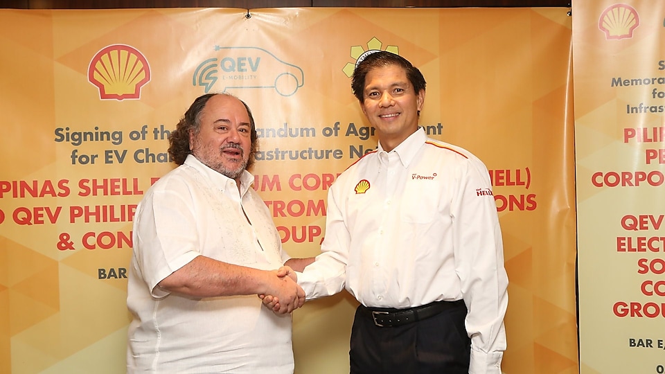 Filipino and Spanish businessmen Endika Aboitiz and Enrique Banuelos shaking hands