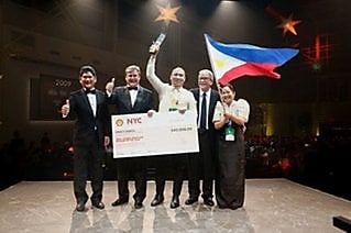 Erwin (center) is joined by Shell executives during the awarding  ceremonies at the Shell Global Smiling Stars awards in New York