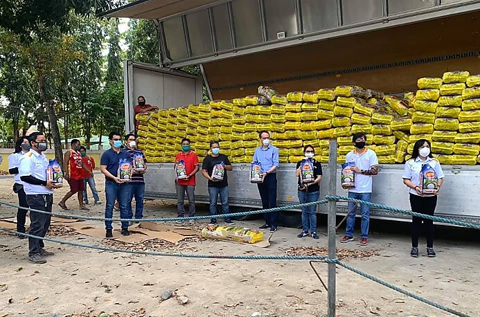 #ProjectSHELTER. Lorry truck full of rice sacks on background, PSPC Tabangao Refinery and PSFI staffs joined forces to help the fence line communities.