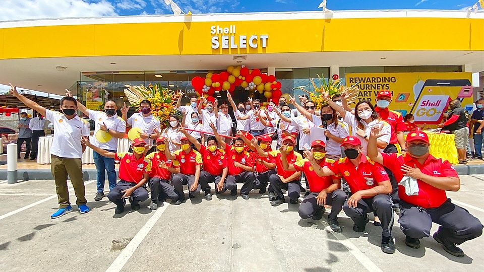 Shell Bridges Town Plaridel Mandaue station forecourt staff celebrate the opening of the new mobility station