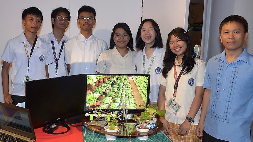 Team Agribon alongside their agricultural drone. The team created their agricultural machine to address the harsh weather and mountainous terrain of Nueva Vizcaya to help raise the efficiency in growing crops.