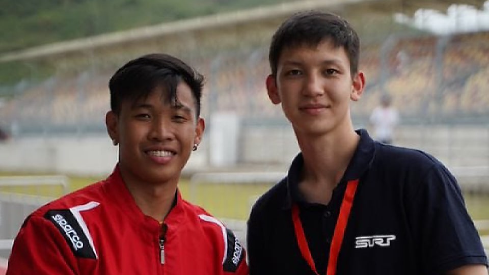 Philippine team's driver, Mark Angelo Jacinto, and Kazakhstan team's driver, Sakenov Erasyl, pose for the camera after their teams worked together for the PH team to successfully complete the Technical Inspection