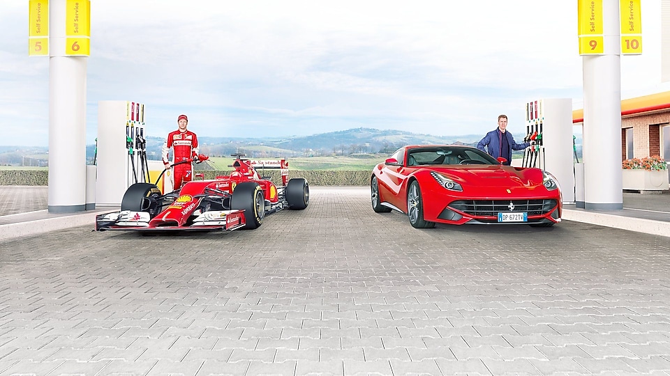 Sebastian Vettel and Kimi Raikkonen fill up Ferrari cars at a Shell station