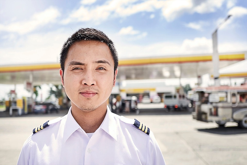Paolo photographed in front of a Shell gas station
