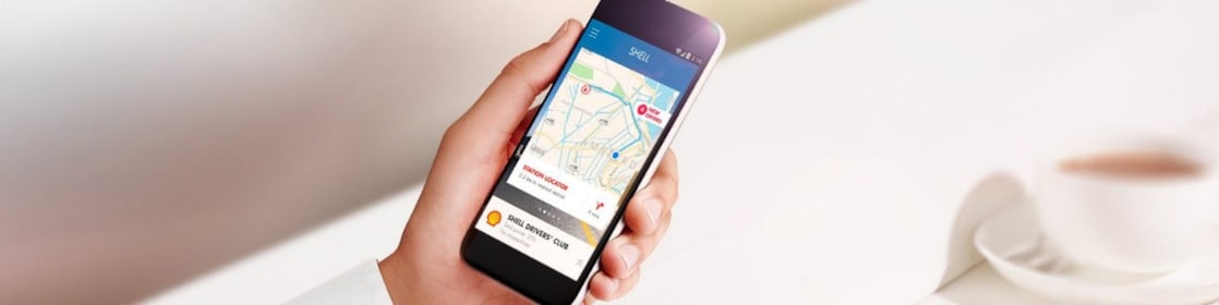 A close up of a person’s hand holding a smart phone