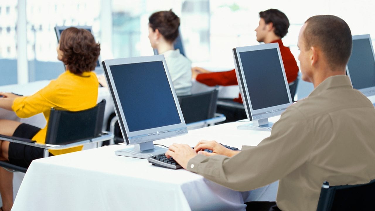Employees using computers in an office