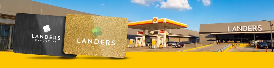 Black Landers Executive Membership Card and Gold Regular Landers Membership Card on the left side of the image, with a Shell Mobility Stations and Landers Superstore on the right side of the image, situated on a background of the sky at the top of the image, and a yellow band at the bottom