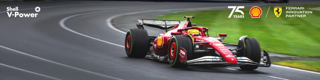 2025 Ferrari F1 SF-25 revving on a race track with Shell V-Power Lock up on the upper left corner, and 75 year partnership with Ferrari lock up on the upper right corner of the image.