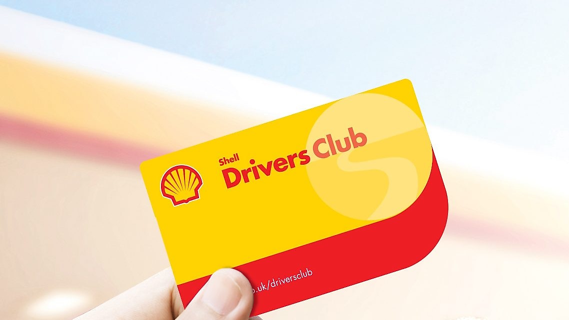 person holding shell drivers club card