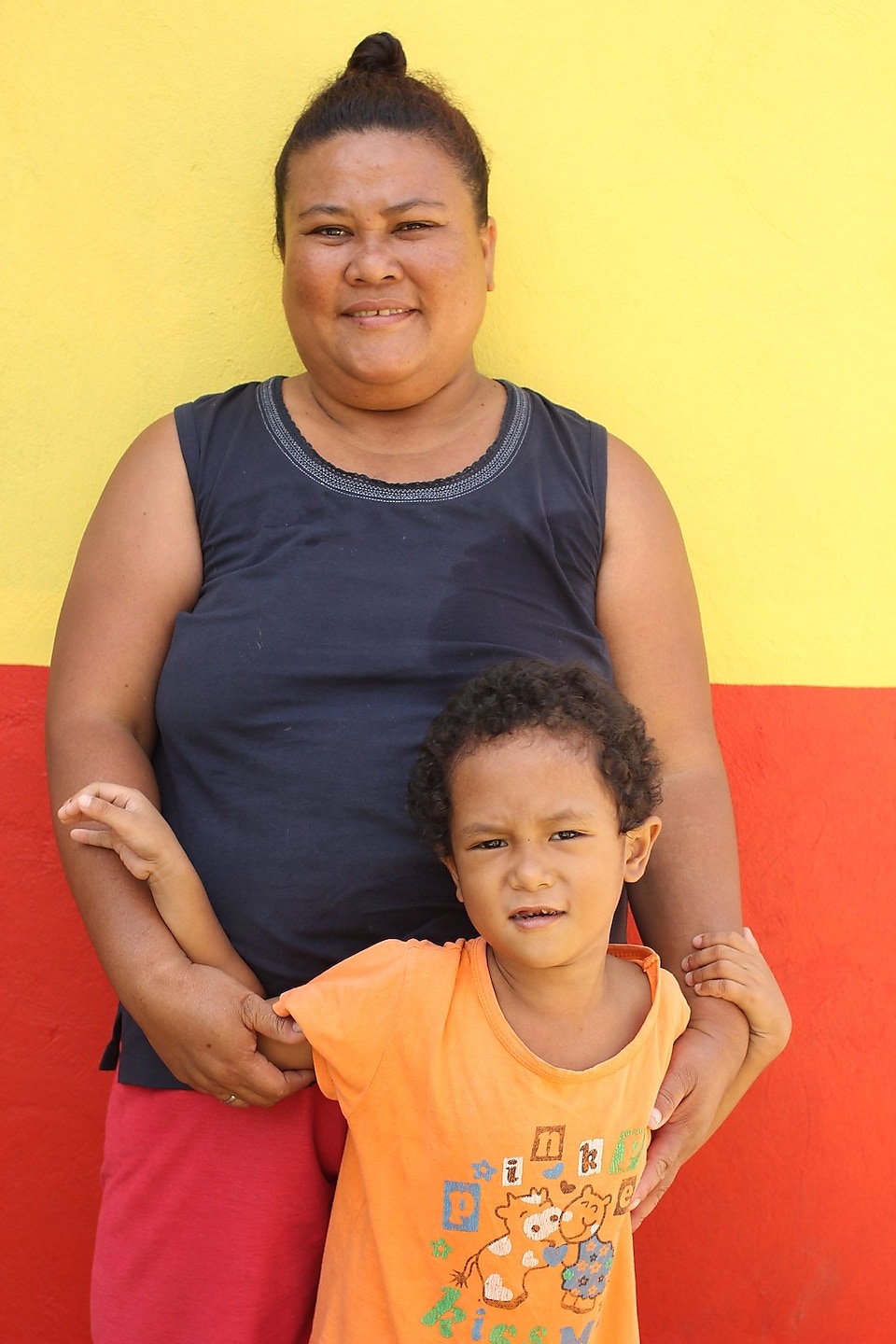 A housing beneficiary with her son 